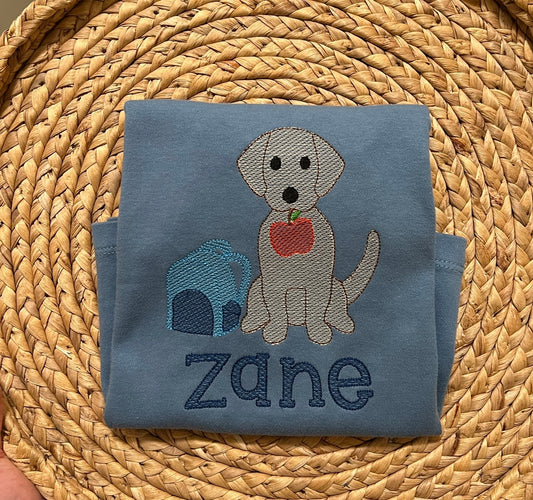 Emb - dog holding apple