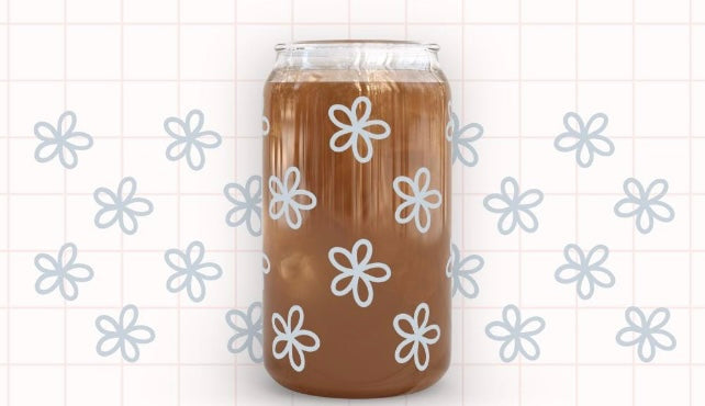 Frosted glass can blue flowers