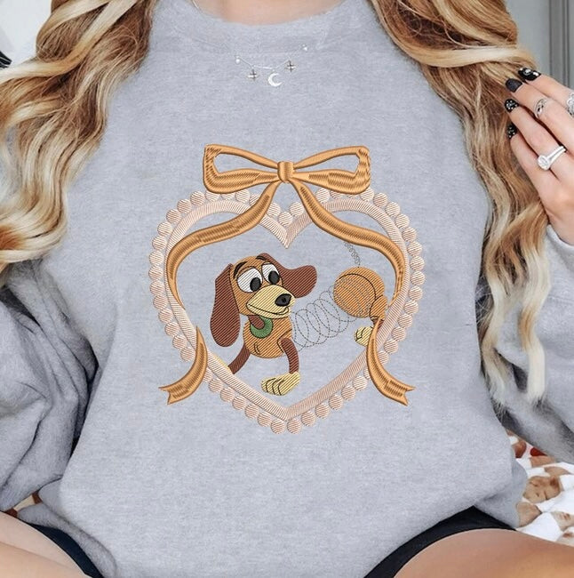 Emb - brown dog heart bow