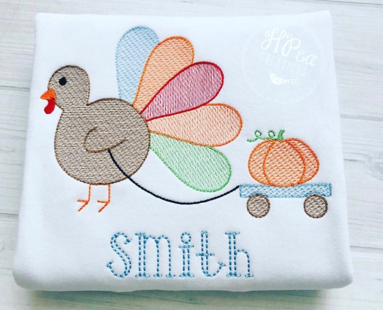 Emb - turkey pulling pumpkin