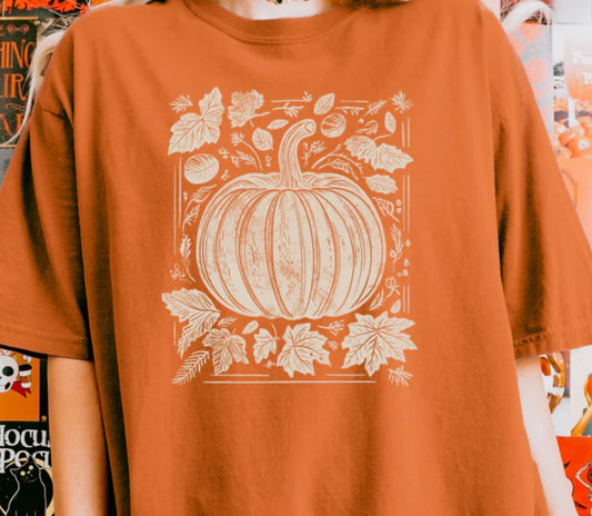 Tan pumpkin and leaves